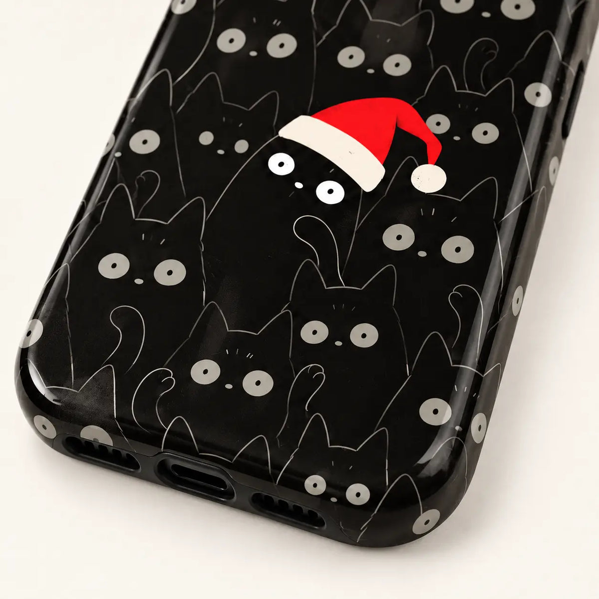 Close-up of the curved lower corner with the black cat pattern extending over the case edge.