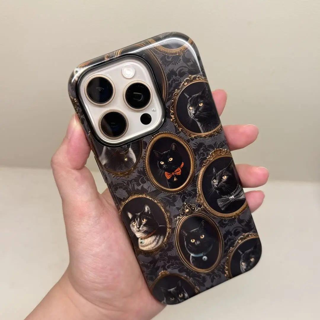 This Halloween phone case features a vintage-inspired design with black cats in ornate frames, blending Gothic aesthetics with a touch of spooky mystery.