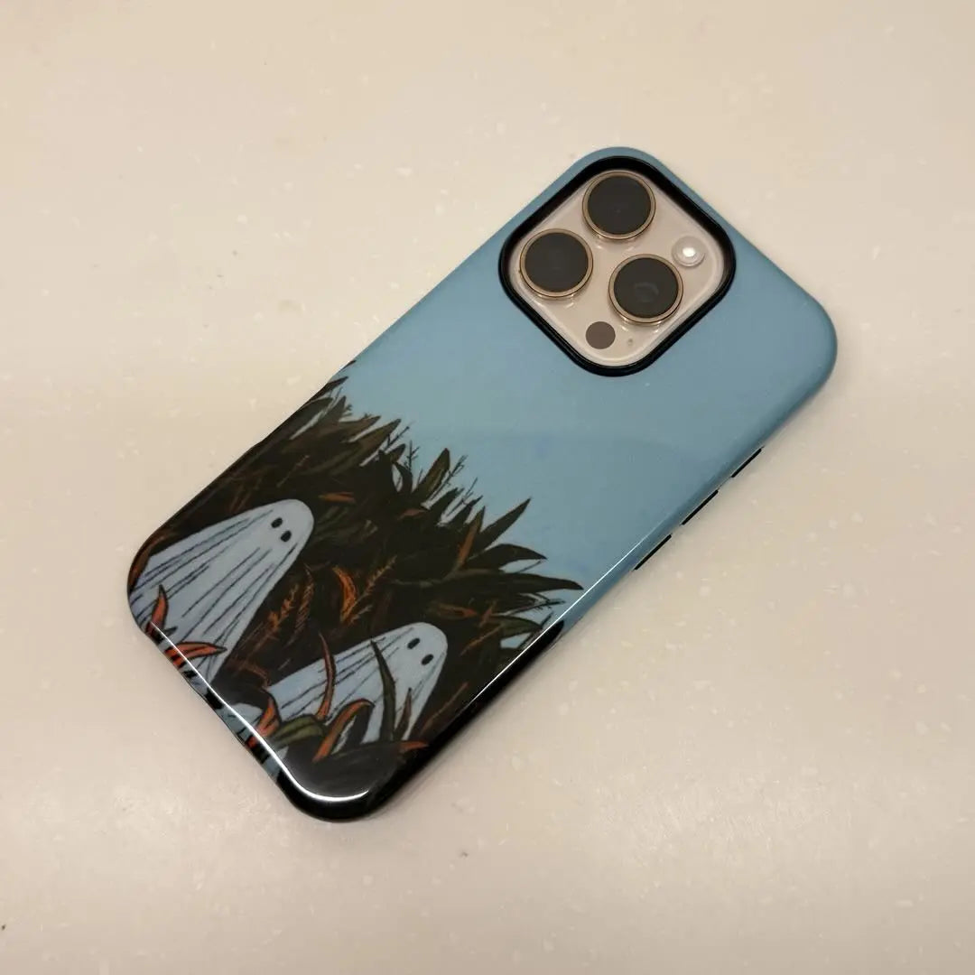 This Halloween phone case features an adorable illustration of cute ghosts in a peaceful autumn scene, adding a unique and cozy festive vibe.