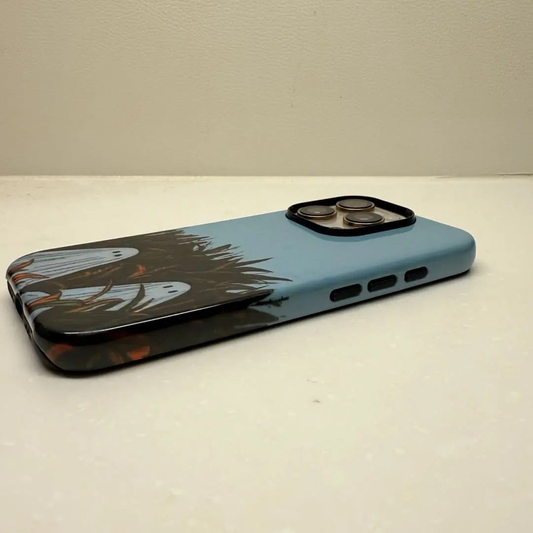 This Halloween phone case features an adorable illustration of cute ghosts in a peaceful autumn scene, adding a unique and cozy festive vibe.