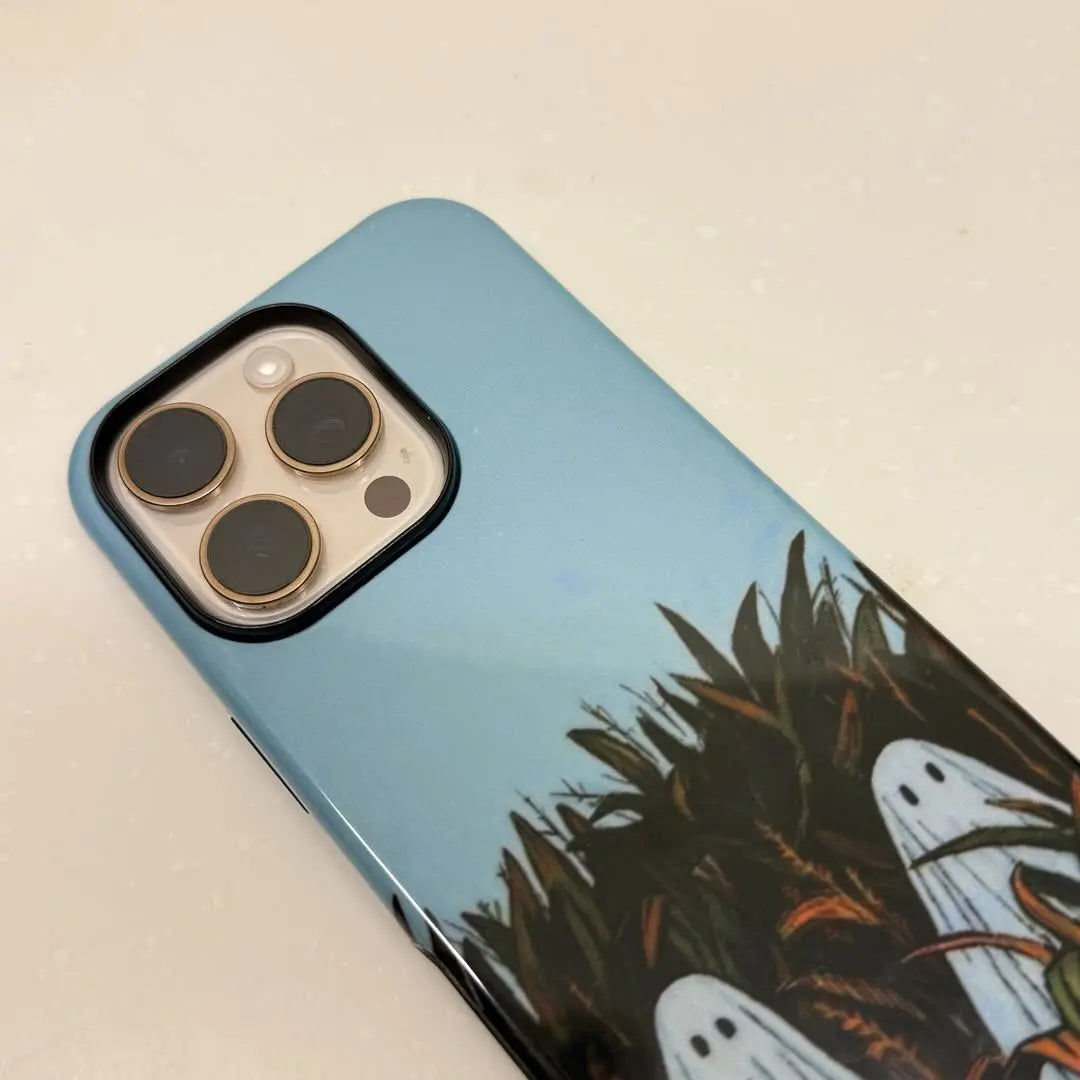This Halloween phone case features an adorable illustration of cute ghosts in a peaceful autumn scene, adding a unique and cozy festive vibe.