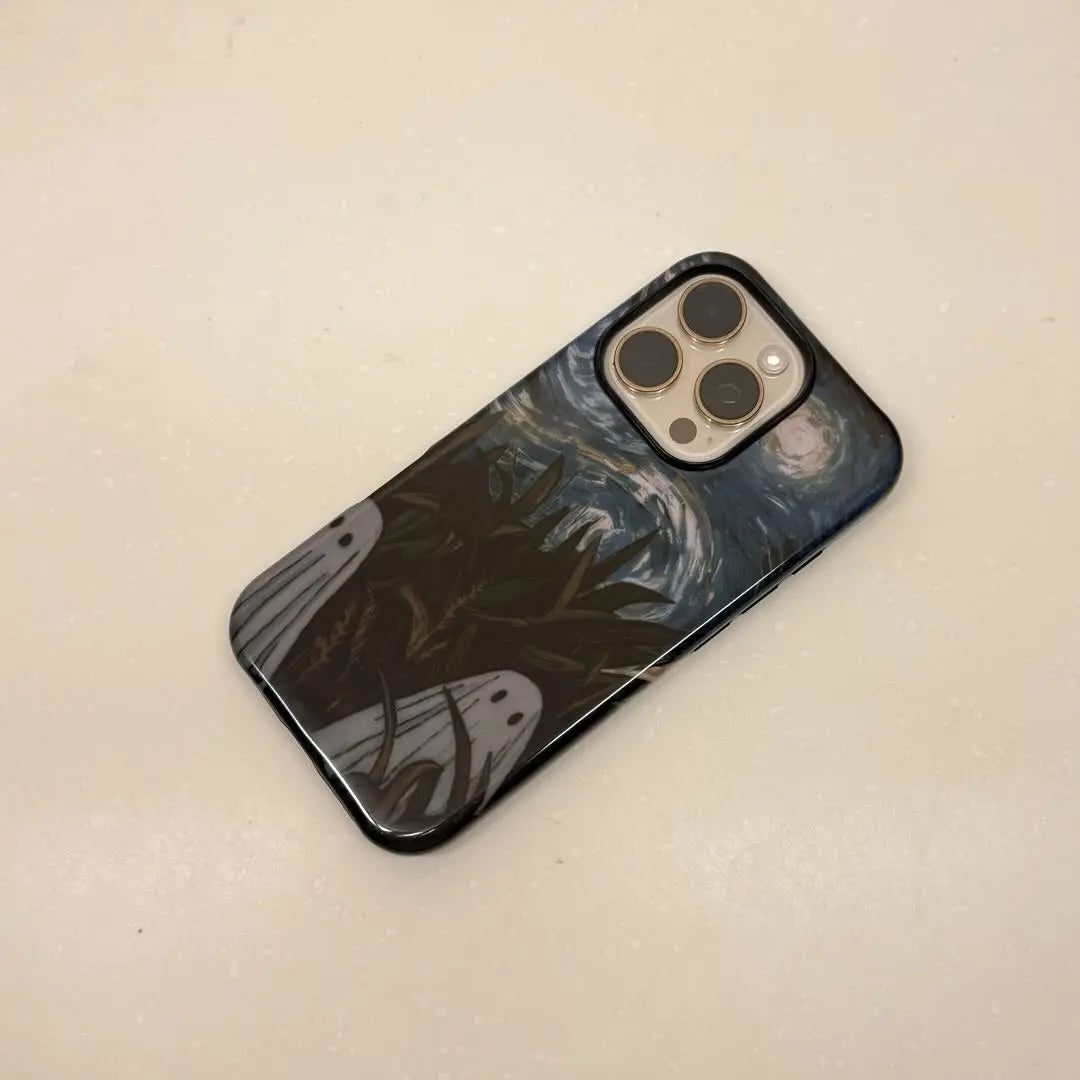This Halloween phone case features a vintage collage of classic elements like pumpkins, black cats, and skeletons, adding a unique festive vibe.