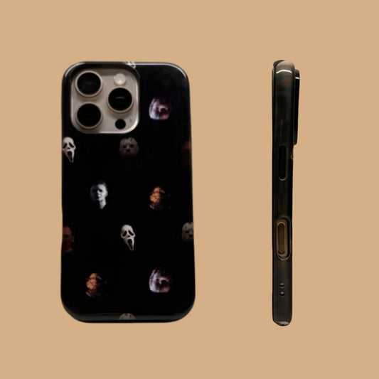 This Halloween phone case features classic horror movie character faces on a black background, offering a subtle yet mysterious vibe for your phone.