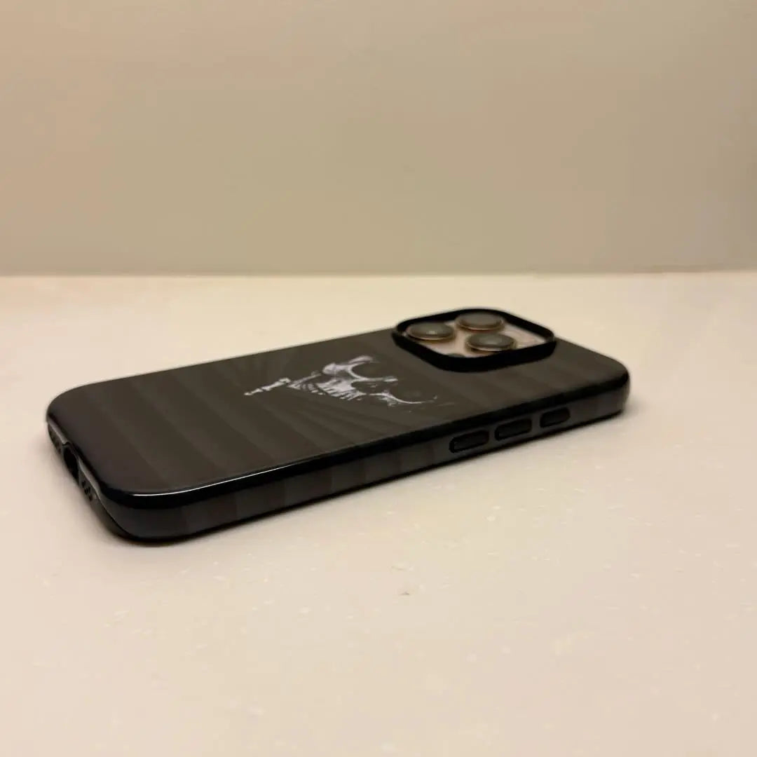 This Halloween phone case features a vintage collage of classic elements like pumpkins, black cats, and skeletons, adding a unique festive vibe.