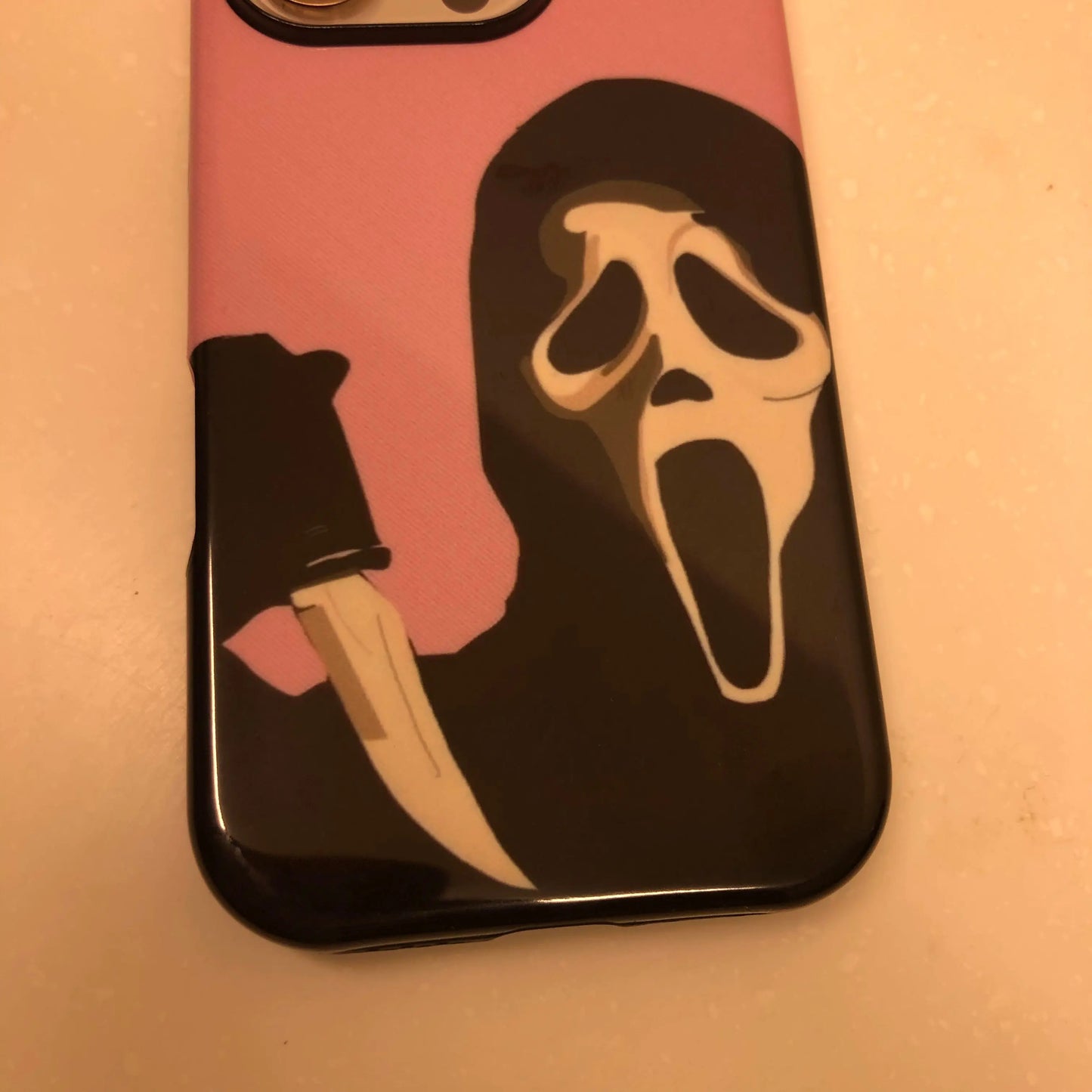 This Halloween phone case features the iconic Ghostface from Scream, offering a simple yet striking design to create a unique and trendy accessory.