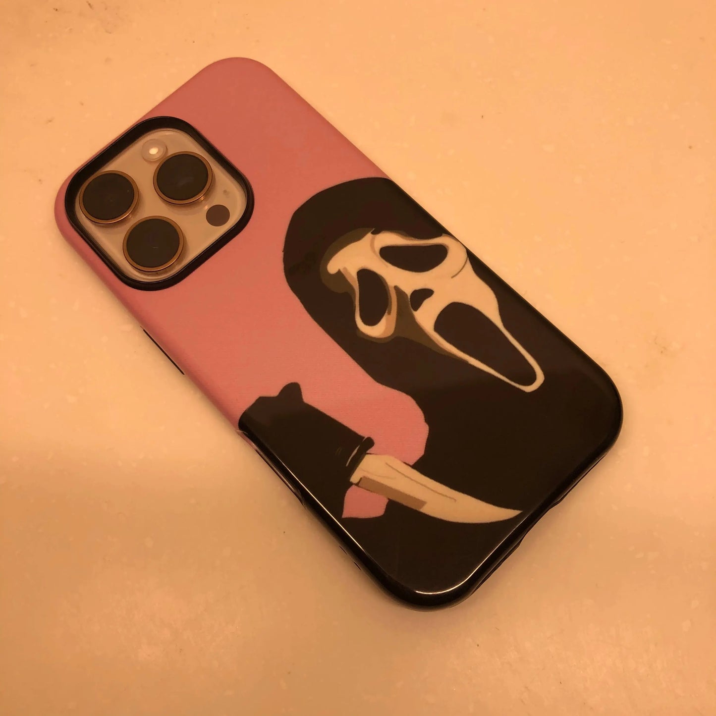 This Halloween phone case features the iconic Ghostface from Scream, offering a simple yet striking design to create a unique and trendy accessory.
