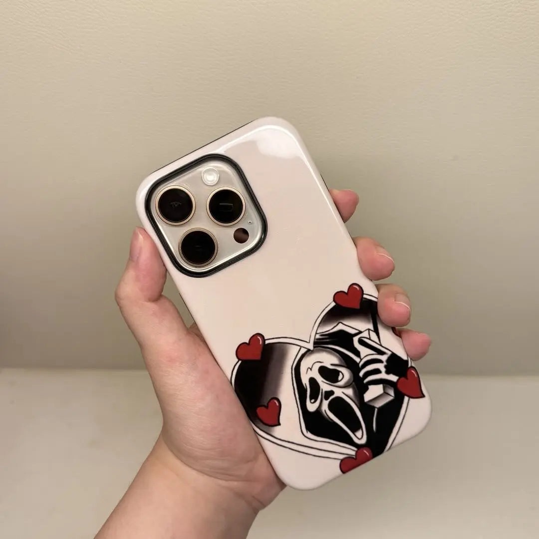 This Halloween phone case features a vintage collage of classic elements like pumpkins, black cats, and skeletons, adding a unique festive vibe.
