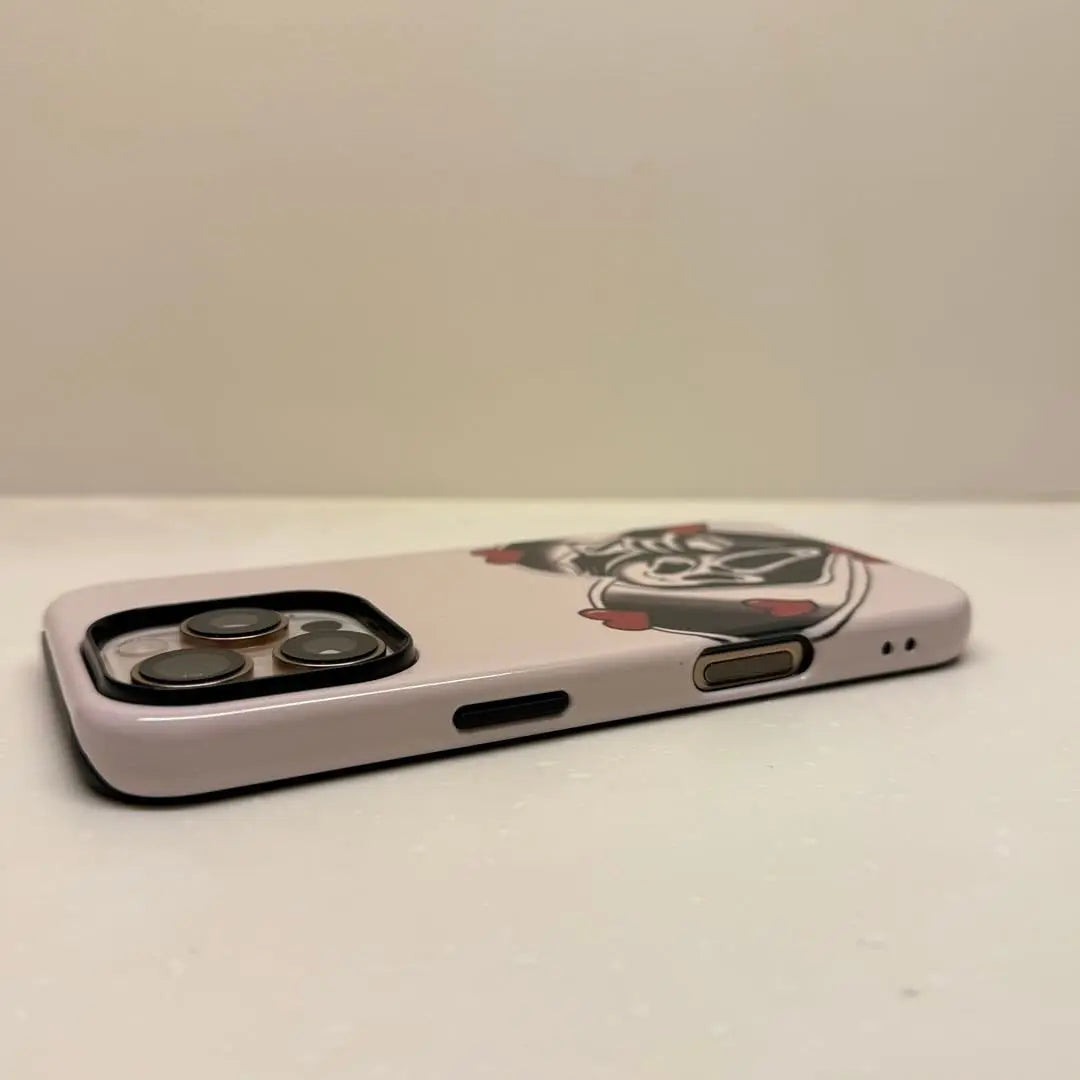 This Halloween phone case features a vintage collage of classic elements like pumpkins, black cats, and skeletons, adding a unique festive vibe.