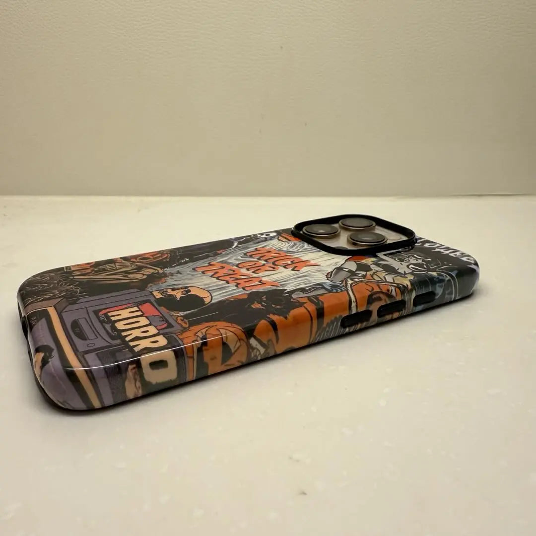 This Halloween phone case features a vintage horror movie poster collage, bringing a unique and trendy vibe that makes you stand out this Halloween.