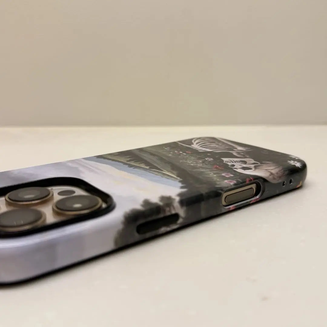 This Halloween phone case features a beautiful oil painting style of a skeleton lying in flowers, blending life and death for a unique artistic touch.