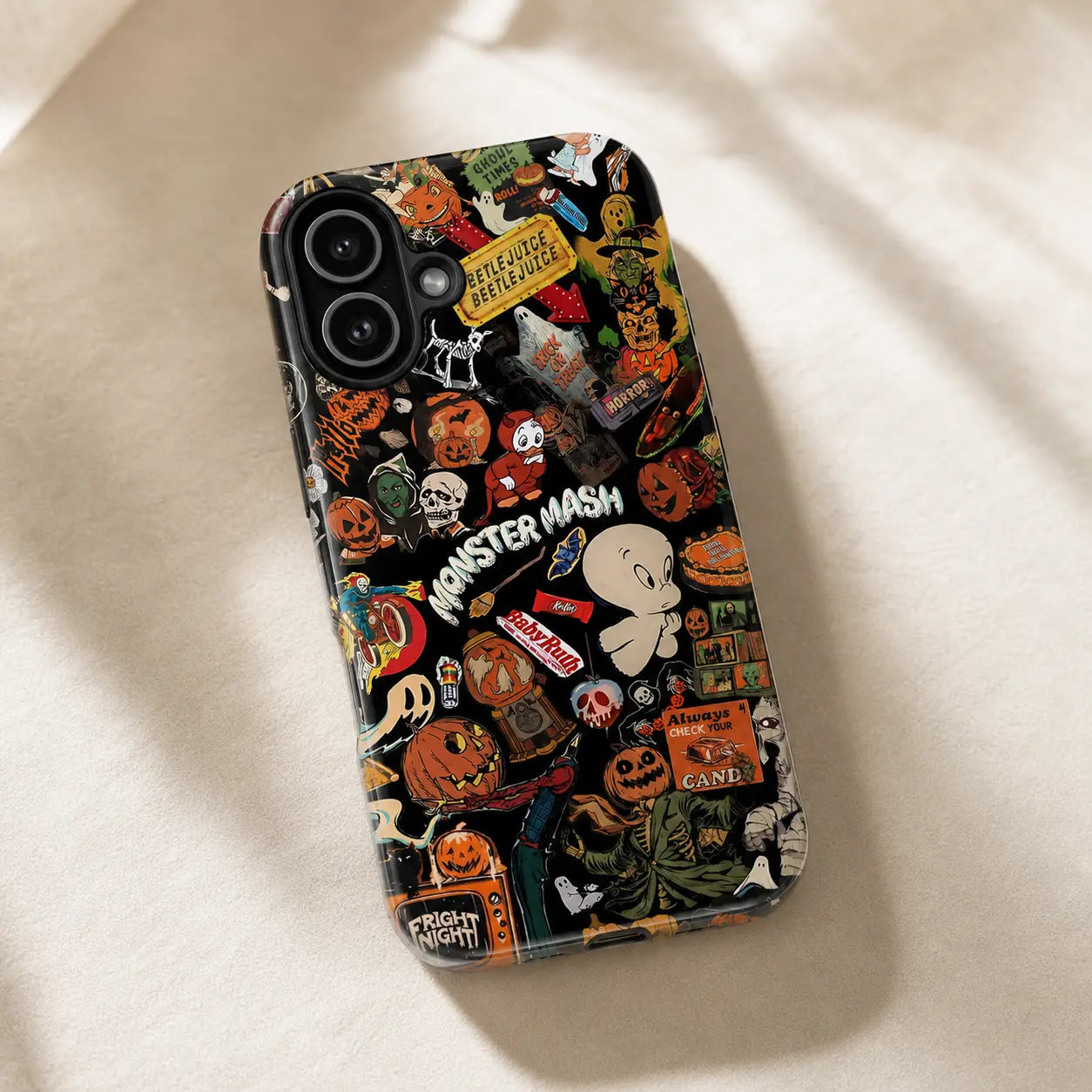 Vintage spooky phone case design with Halloween pumpkins, ghost characters, skull artwork, and sticker-style graphics.