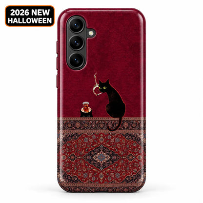 Burgundy Persian rug phone case shown on a Samsung Galaxy, with black cat artwork above a floral medallion design