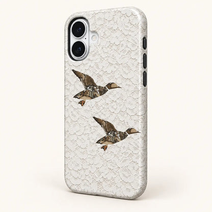 Angled iPhone side view showing continuous edge print: white floral lace print; two camouflage ducks.