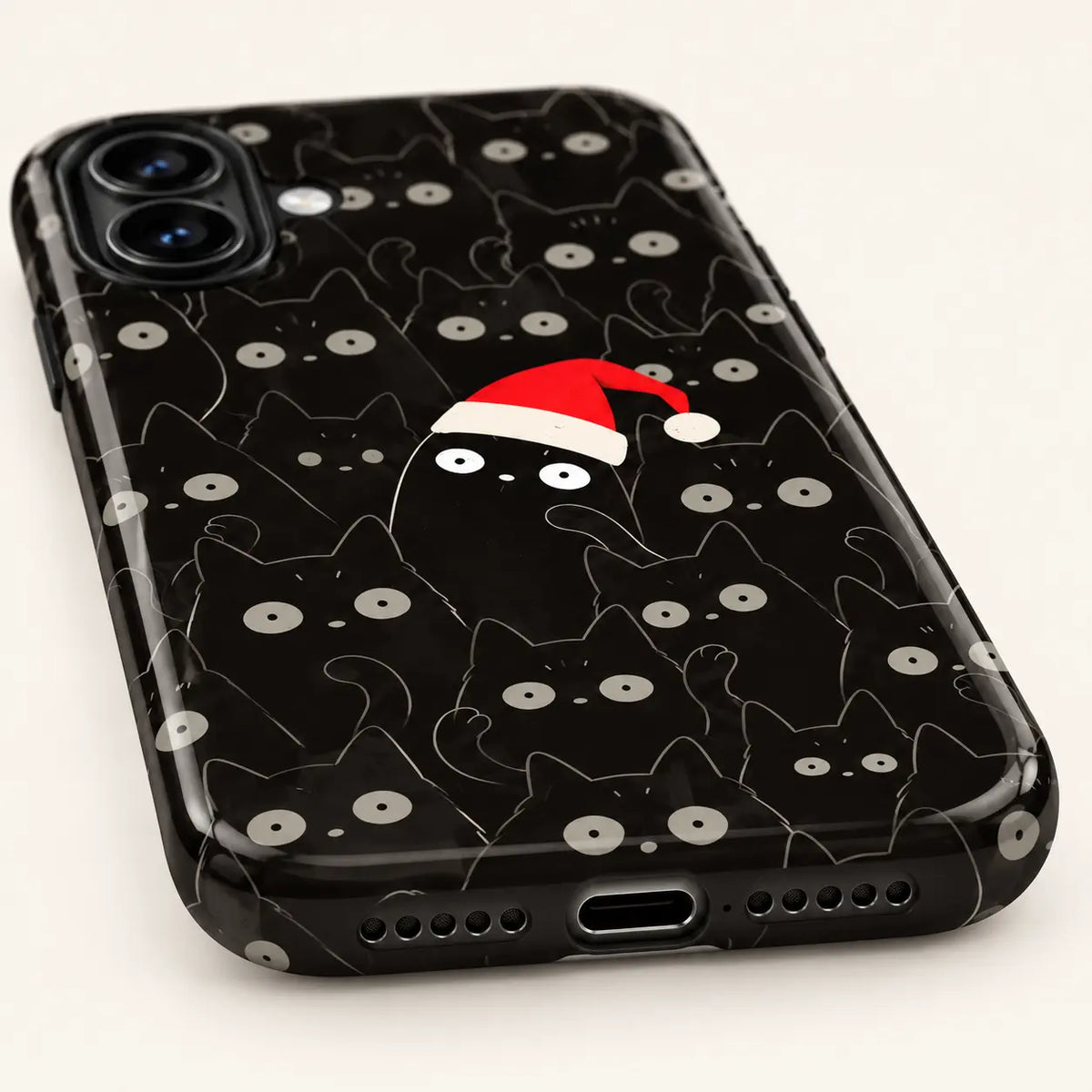 Bottom view of the black cat Christmas case showing the charging-port opening and speaker cutouts.