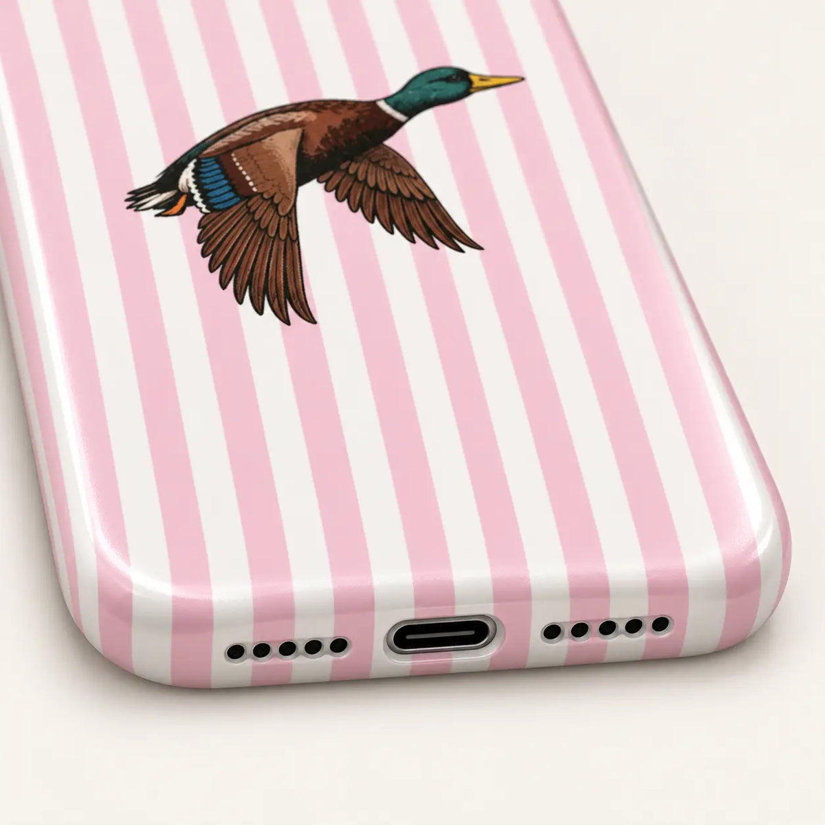 iPhone camera-corner close-up showing: pink and white vertical stripes.