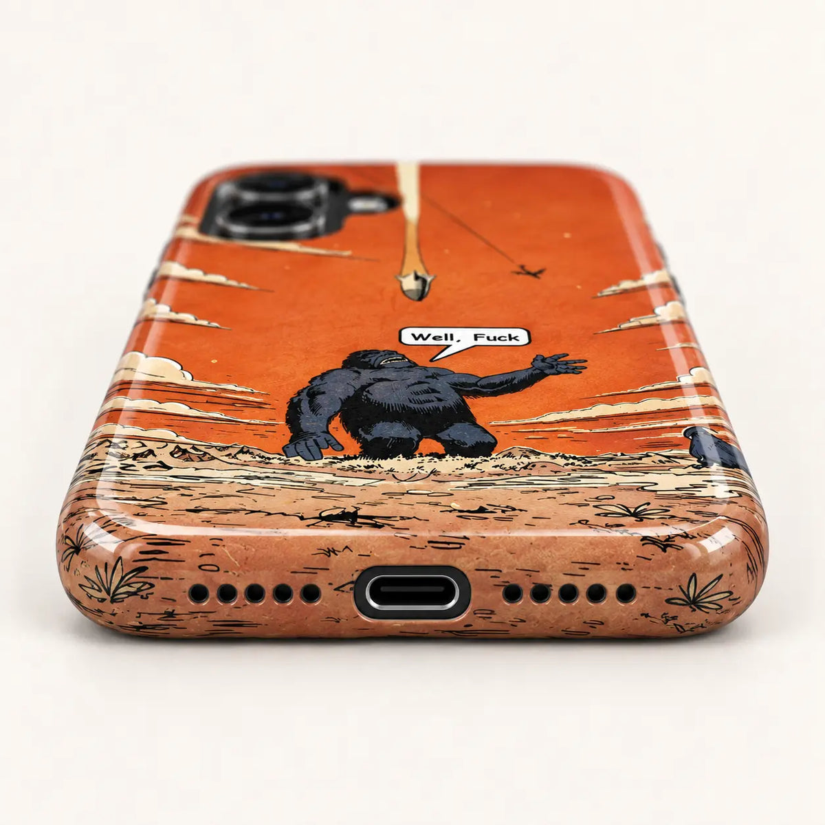 Bottom view of orange comic phone case with USB-C port and ten speaker holes