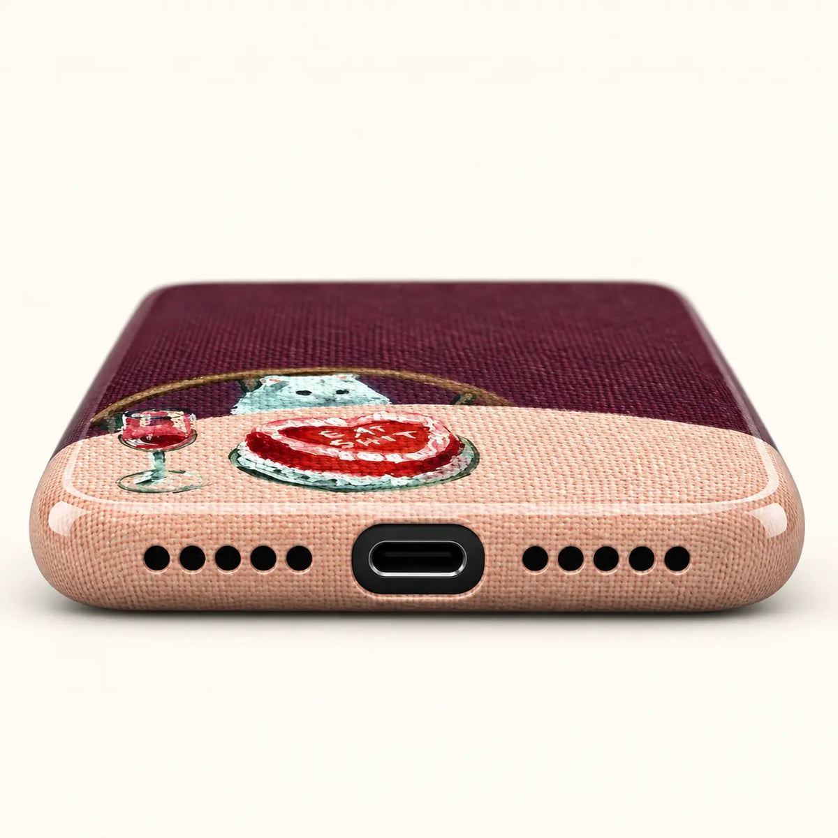 Bottom view of cat cake phone case with USB-C port and ten speaker holes