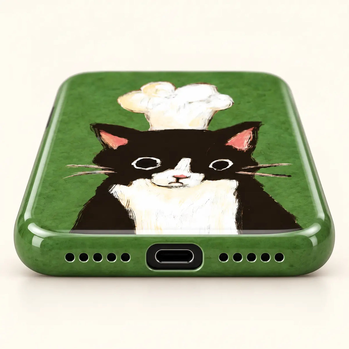 Bottom view of chef cat phone case with USB-C port and ten speaker holes