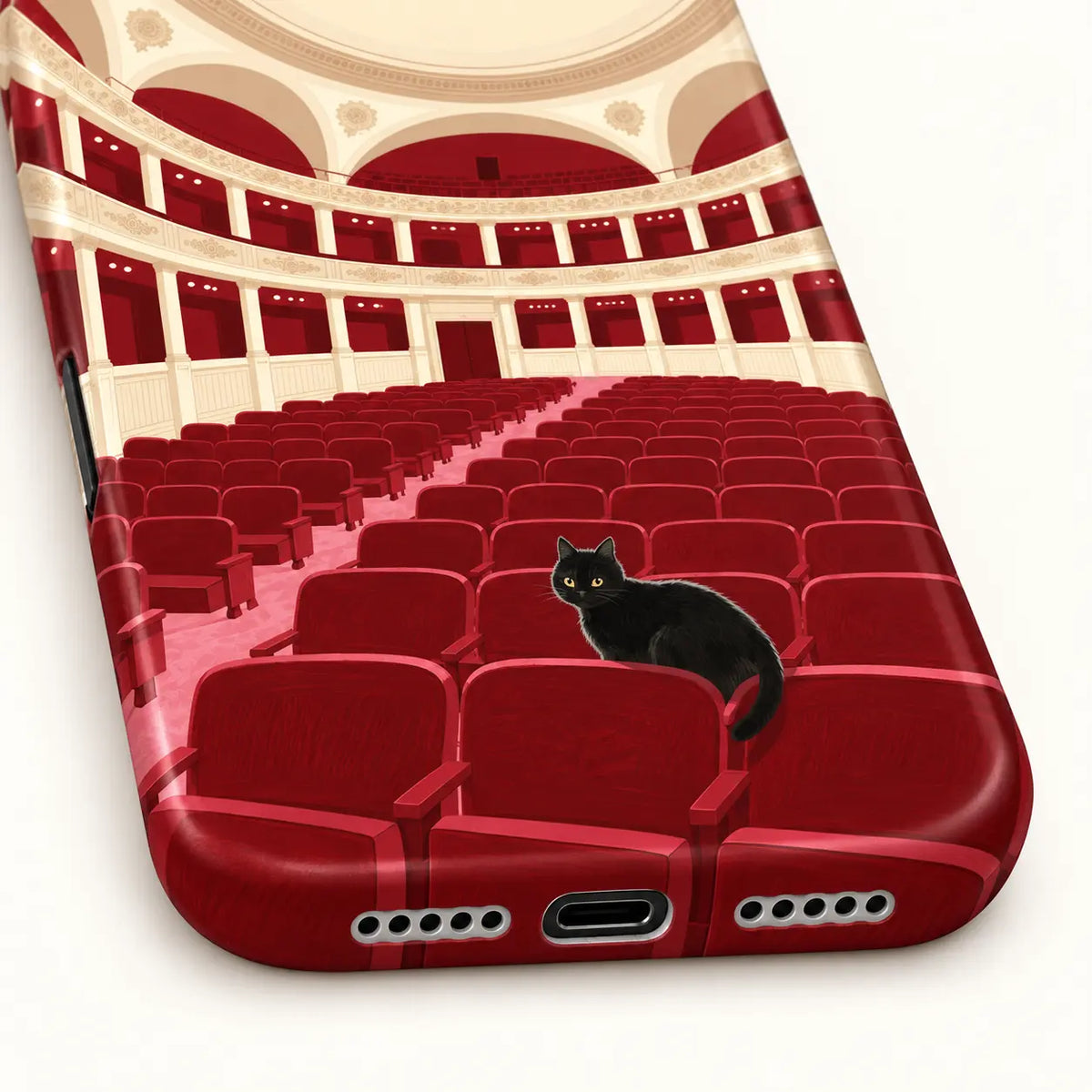 iPhone bottom with charging and speaker openings; Black cat among red theater seats with cream balconies