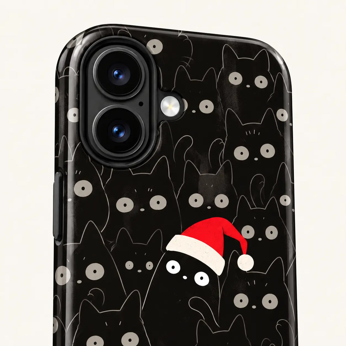 Close-up of the camera surround and black cat print on the Christmas phone case.