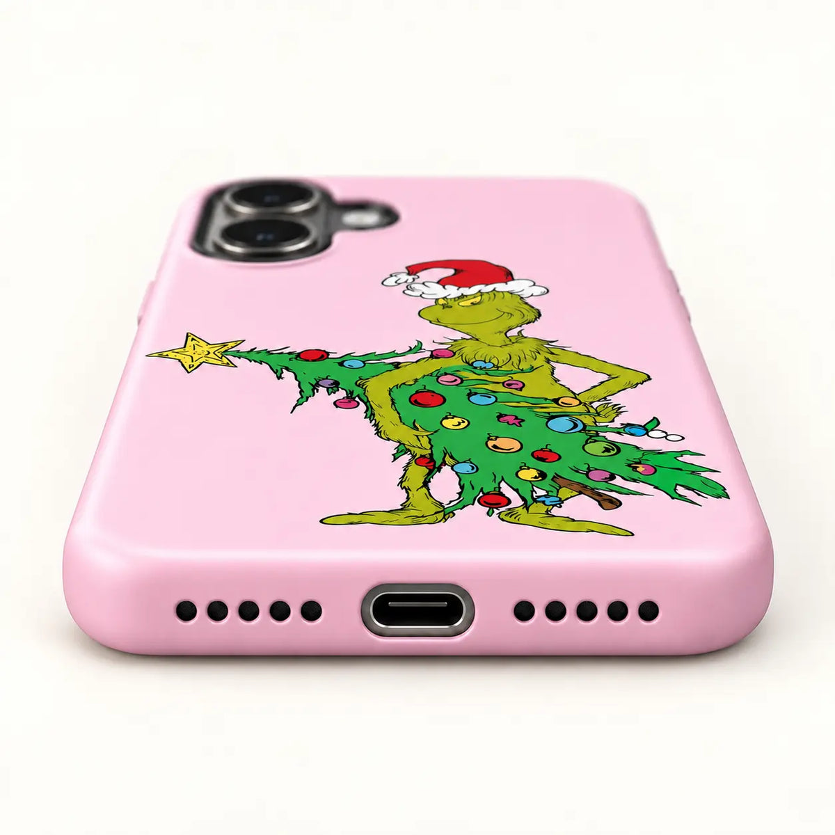 Bottom charging port and speaker holes on the Pink Mean One Christmas Tree phone case