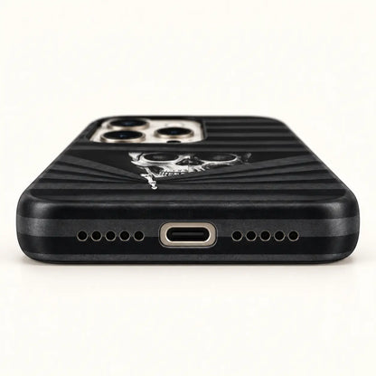 USB-C and speaker opening detail on black striped skull case