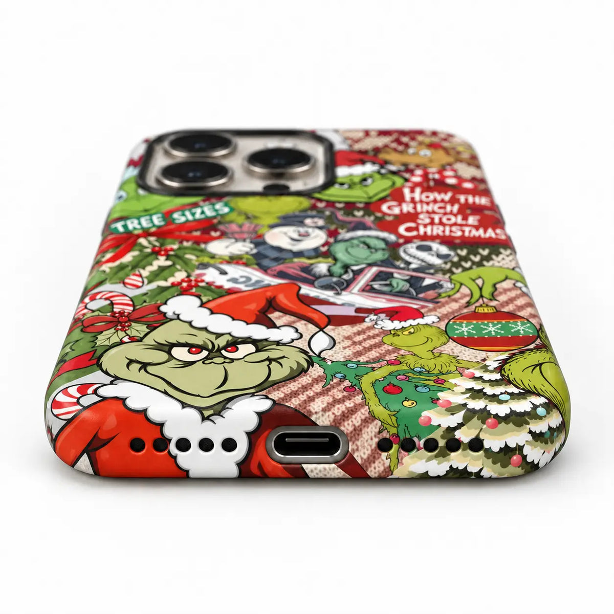 Bottom-port detail of the Christmas collage iPhone case with centered port and speaker holes