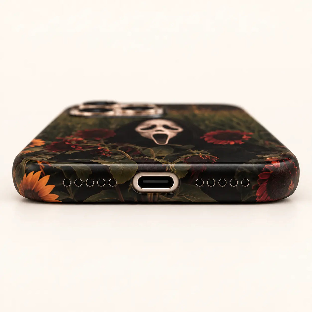 USB-C and speaker opening detail on Ghost Sunflower Field phone case