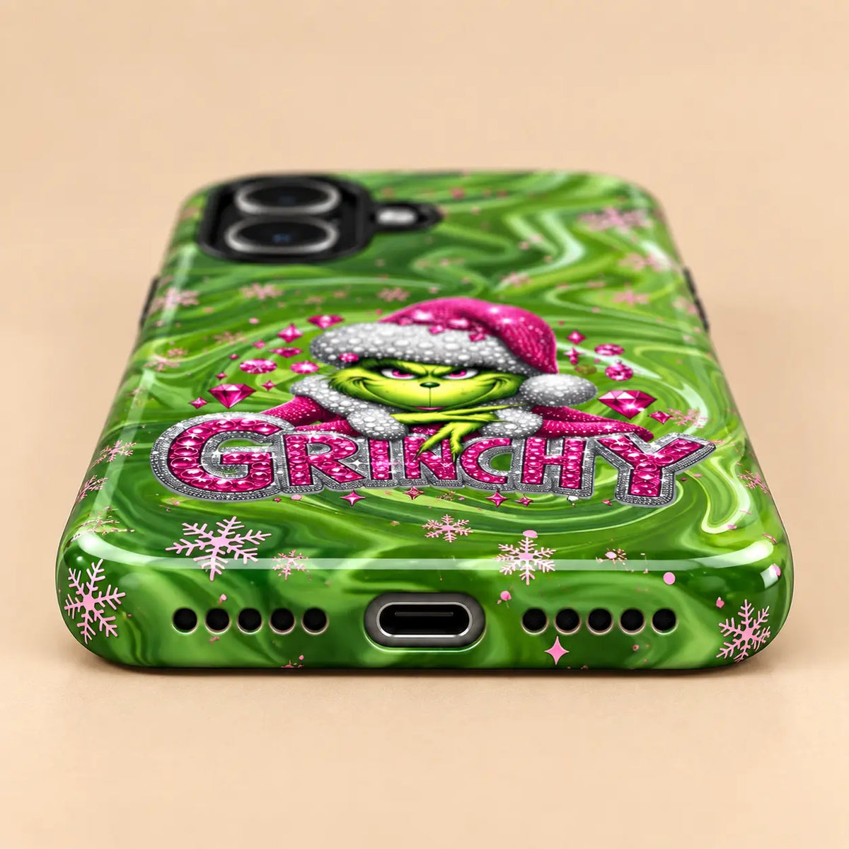 Bottom view of charging port and speaker holes on the green marble Christmas iPhone case