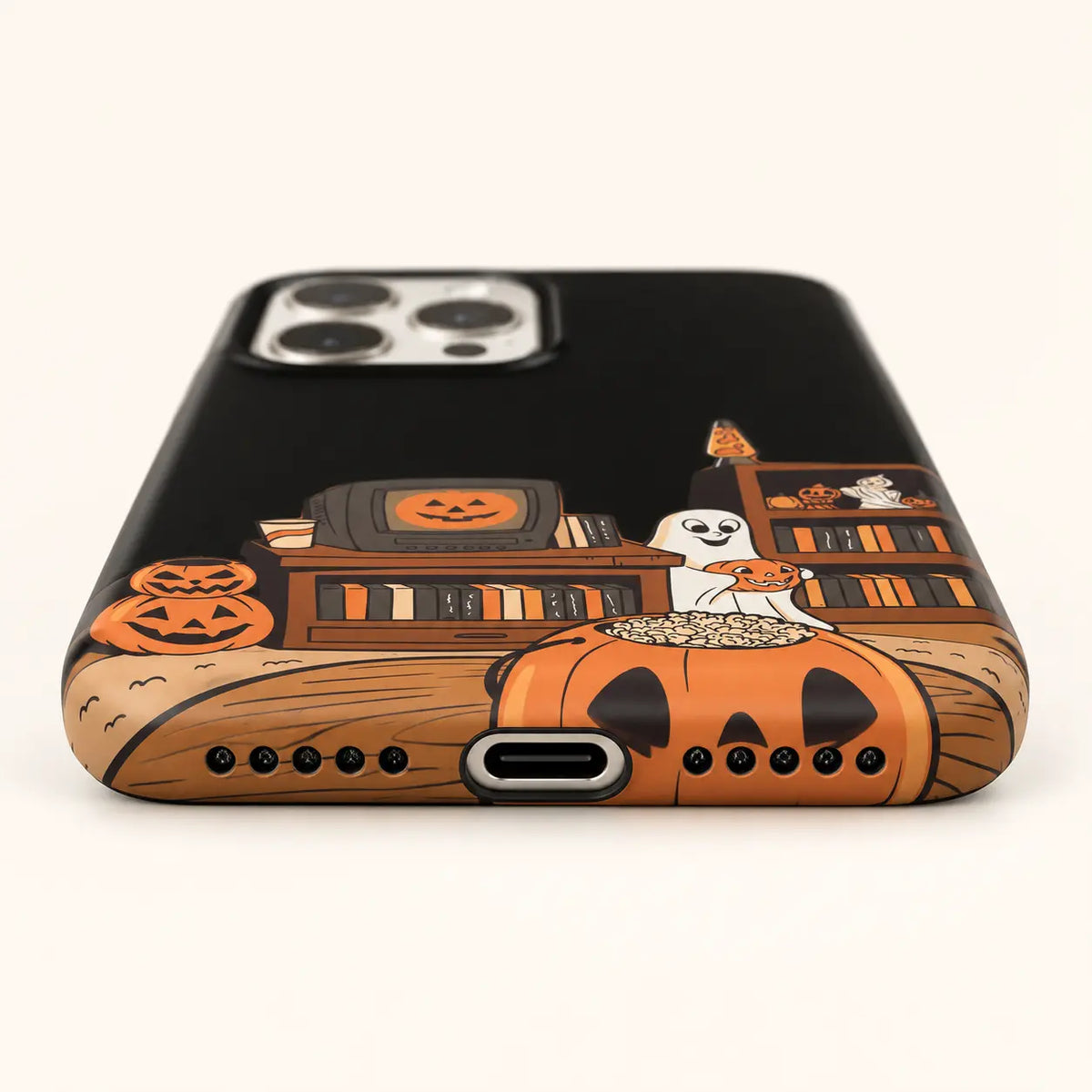 USB-C and speaker opening detail on pumpkin movie-night case