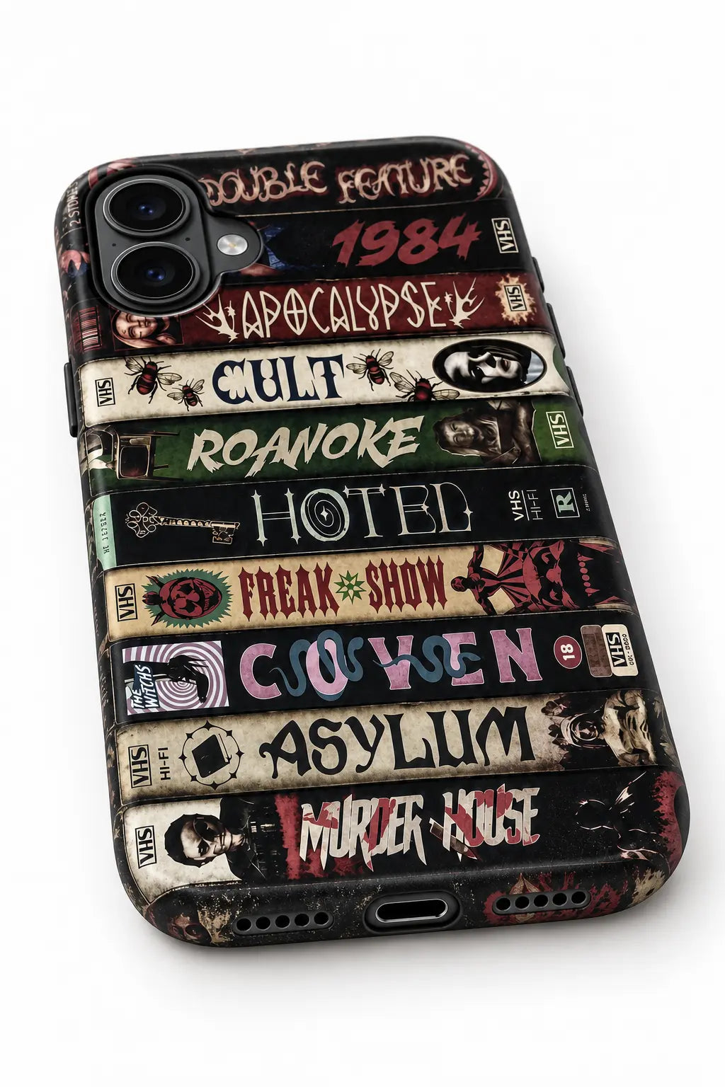 Bottom charging port and speaker detail of horror VHS phone case