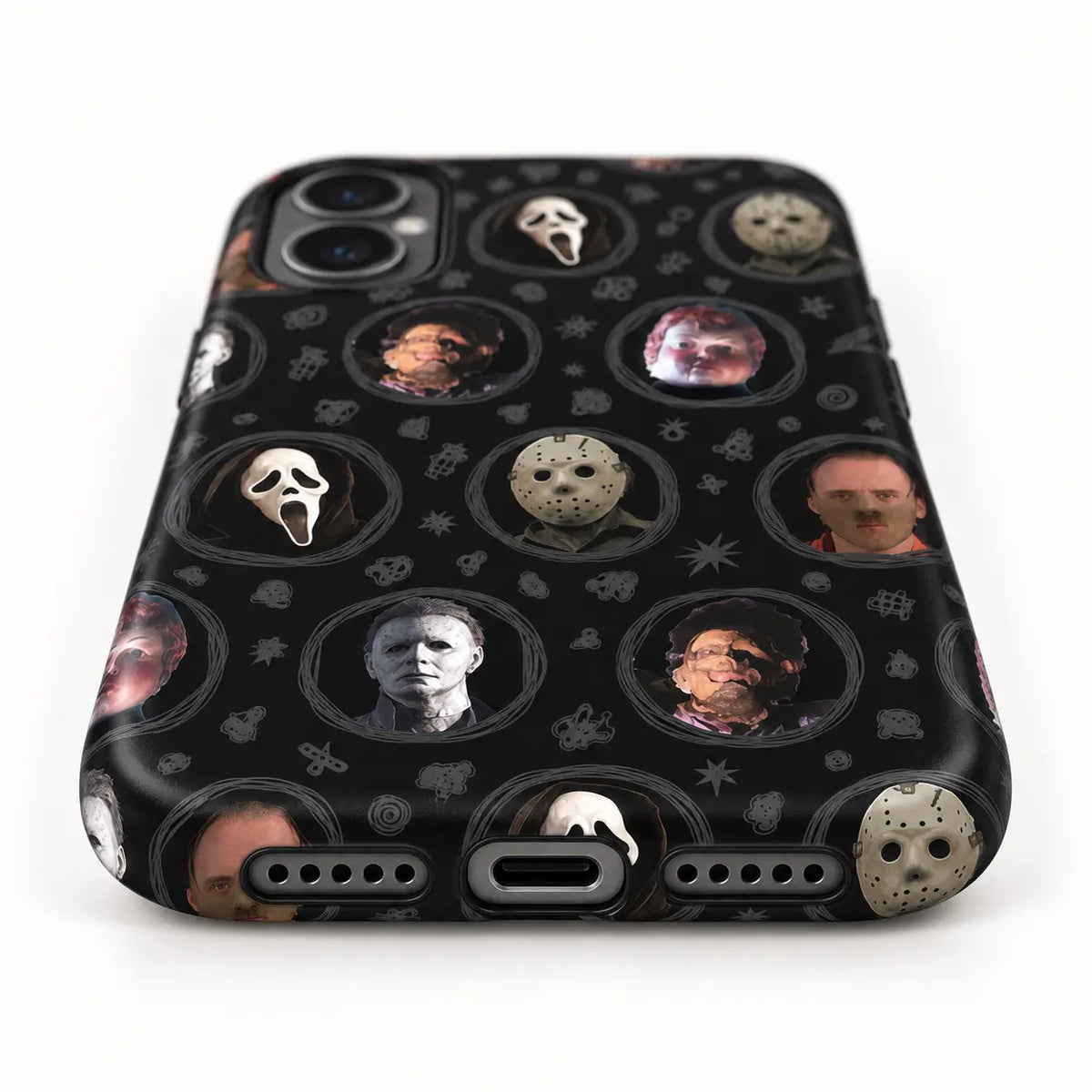 Bottom speaker and charging port detail of horror movie phone case