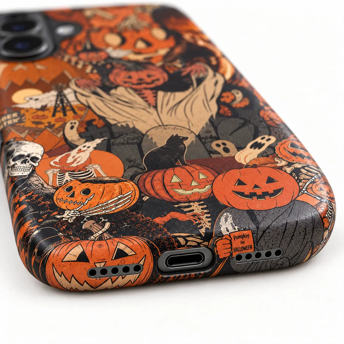 Bottom charging port and speaker detail on pumpkin collage case