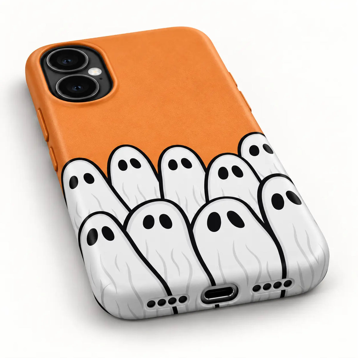 Bottom charging port and speaker detail of orange Halloween phone case