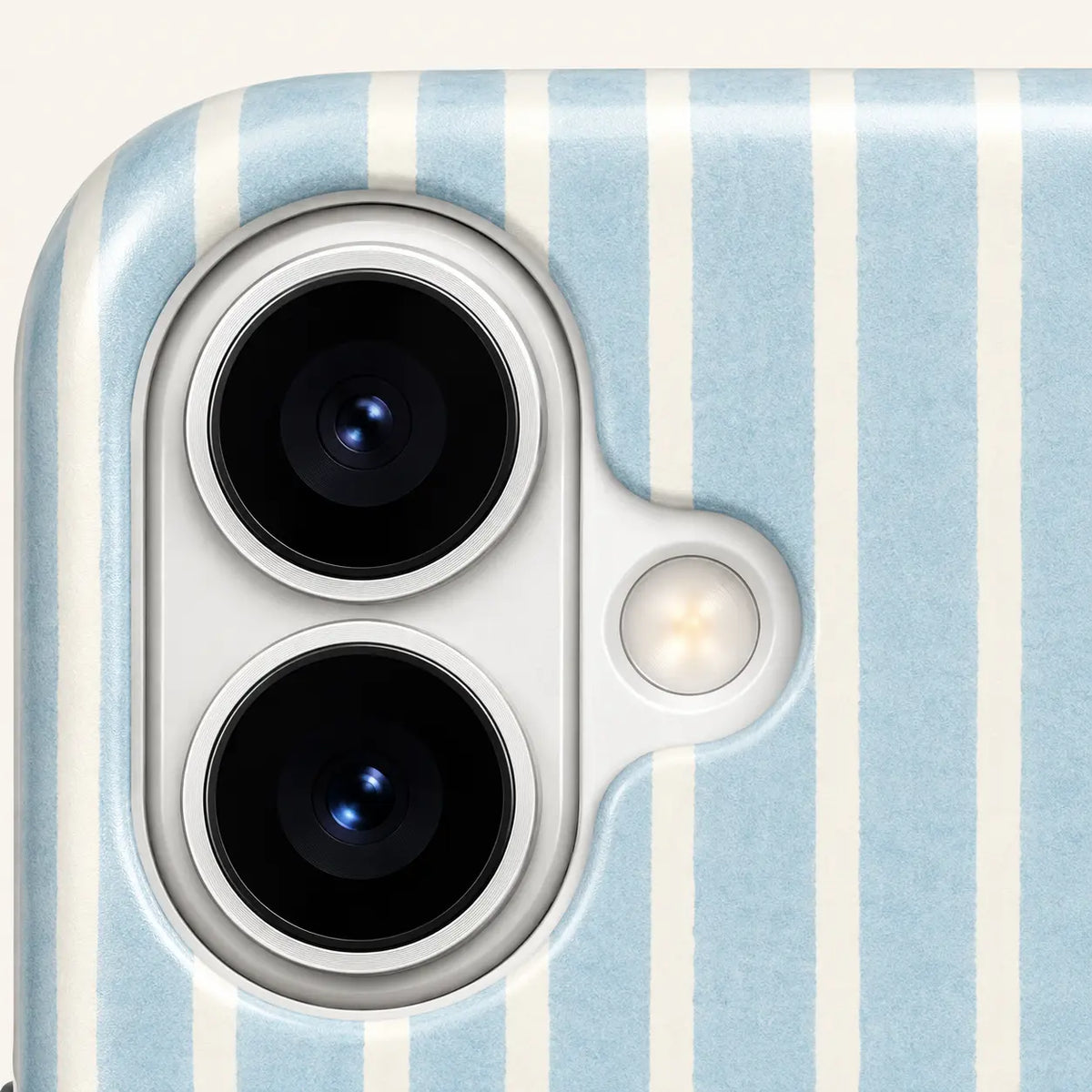 iPhone camera-corner close-up showing: pale blue and cream vertical stripes.