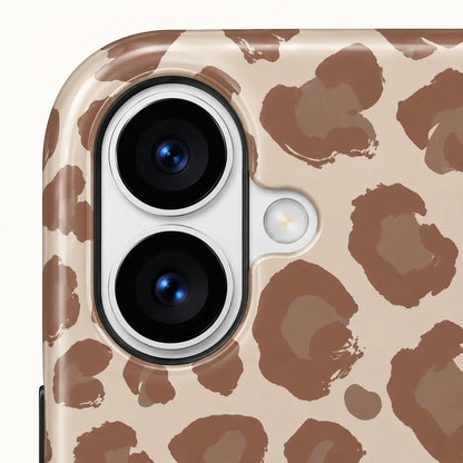 iPhone camera-corner close-up showing: beige and taupe leopard spots.