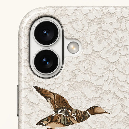iPhone camera-corner close-up showing: white floral lace print.