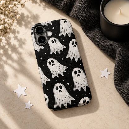 Little Ghost phone case styled with black fabric, candle and paper stars