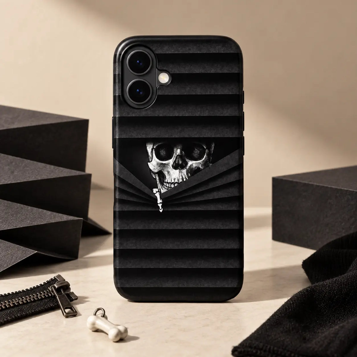 Peeking Skull phone case displayed with dark zipper-themed props