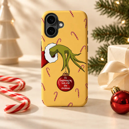 Christmas phone case displayed with candy canes and festive ornaments