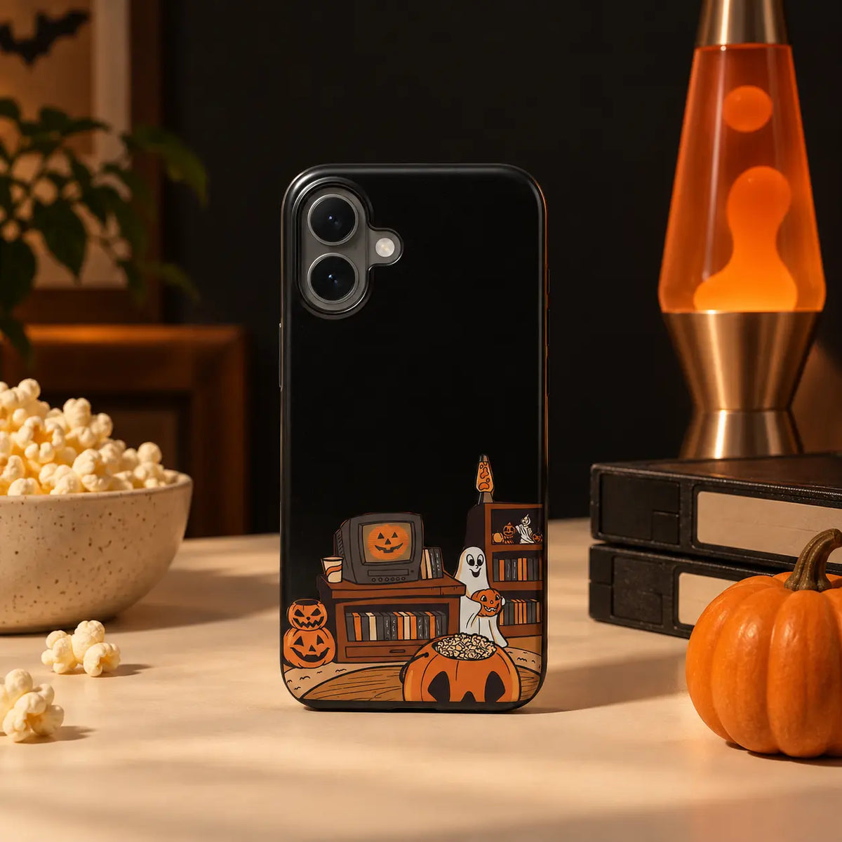 Halloween Movie Night phone case displayed with popcorn and pumpkin props