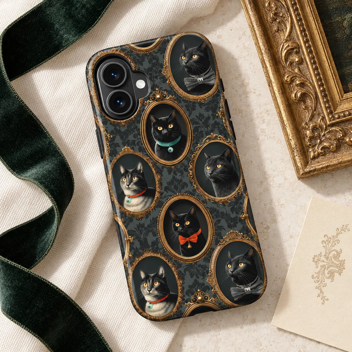 Victorian black-cat case styled with a gold frame and velvet ribbon