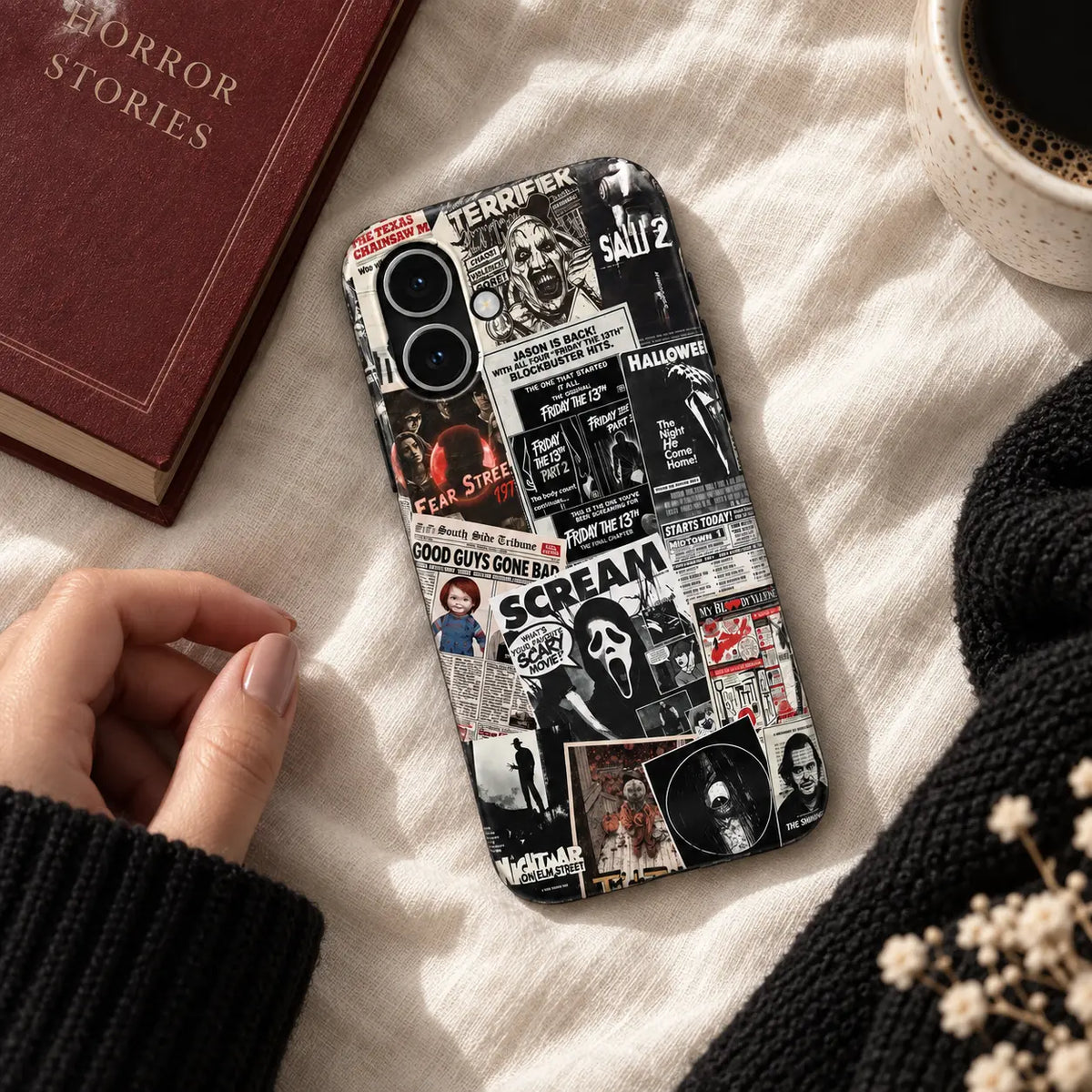Vintage horror collage iPhone case displayed on warm white linen