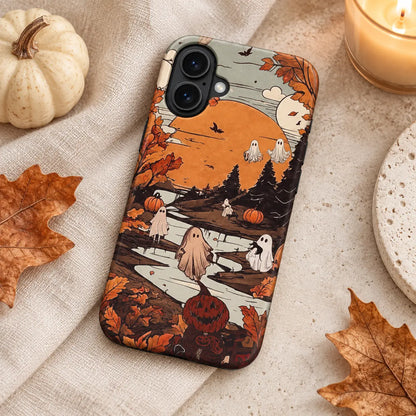 Spooky Town ghost phone case styled with autumn leaves and candlelight