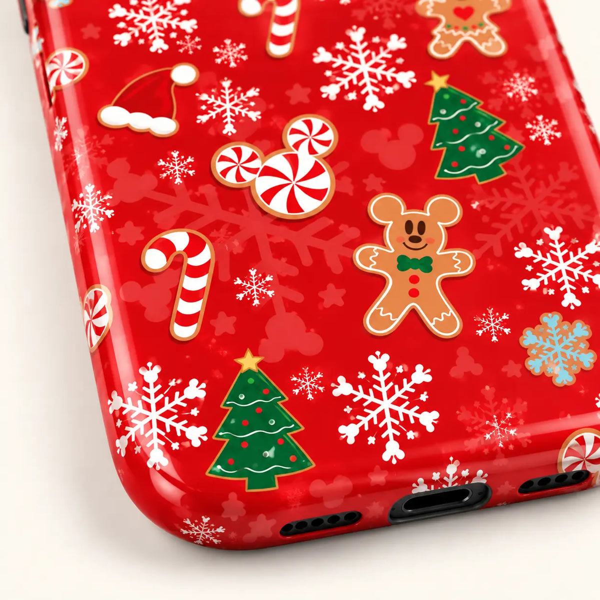 Rounded lower corner showing the red holiday pattern extending over the case edge.