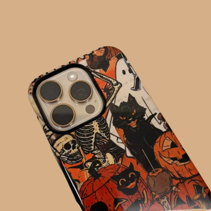 This Halloween phone case features a vintage collage of classic elements like pumpkins, black cats, and skeletons, adding a unique festive vibe.