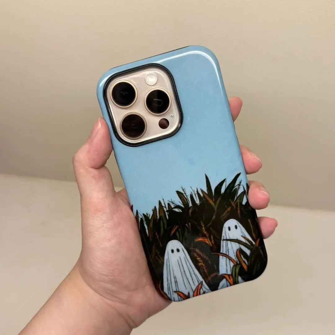 This Halloween phone case features an adorable illustration of cute ghosts in a peaceful autumn scene, adding a unique and cozy festive vibe.