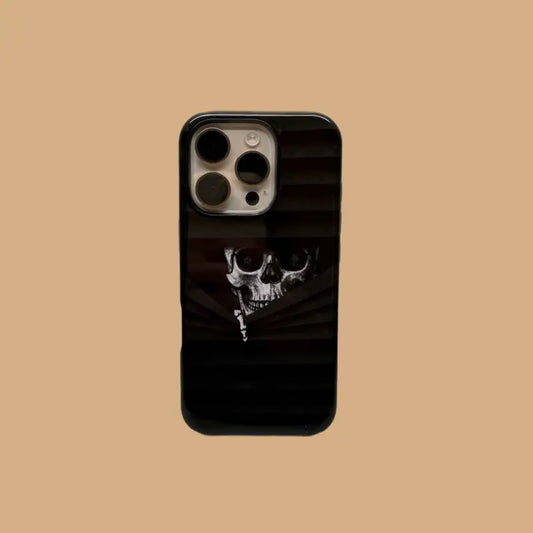 This Halloween phone case features a vintage collage of classic elements like pumpkins, black cats, and skeletons, adding a unique festive vibe.