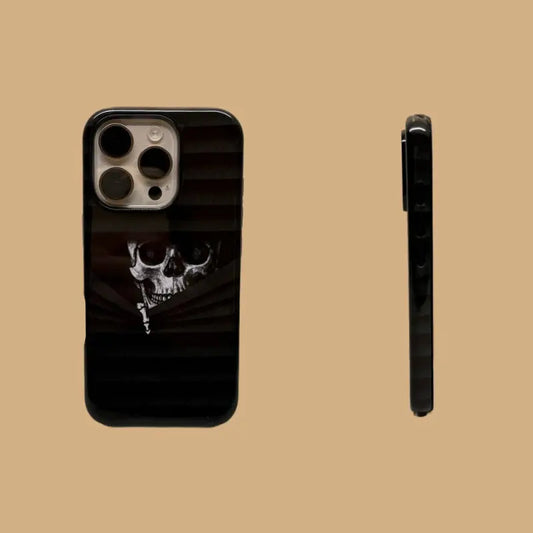 This Halloween phone case features a vintage collage of classic elements like pumpkins, black cats, and skeletons, adding a unique festive vibe.