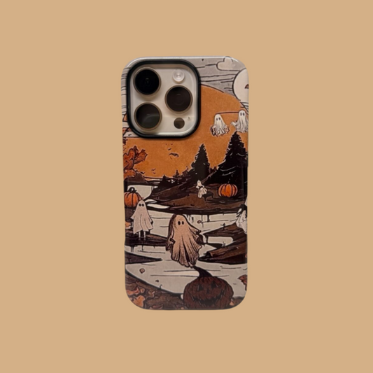 This vintage-style Halloween phone case features a charming illustration of ghosts and pumpkins, adding a unique and cozy autumn vibe to your phone.